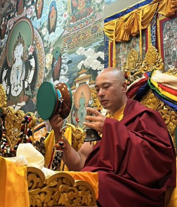 Rinpoche playing drum